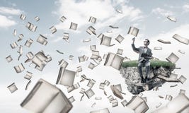 El hombre de negocios o el estudiante que estudia la ciencia y los libros jovenes vuelan alrededor imagenes de archivo El hombre de negocios o el estudiante que estudia la ciencia y los libros jovenes vuelan alrededor imagenes de archivo