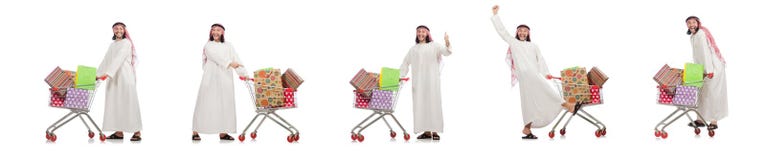 El hombre árabe que hace las compras aisladas en blanco fotografía de archivo El hombre árabe que hace las compras aisladas en blanco fotografía de archivo