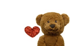 El oso de peluche sonriente con la foto borrosa de la forma del amor foto de archivo El oso de peluche sonriente con la foto borrosa de la forma del amor foto de archivo