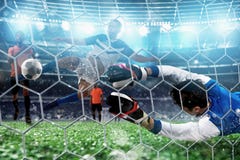 El portero coge la bola en el estadio durante un partido de f?tbol foto de archivo libre de regalías El portero coge la bola en el estadio durante un partido de f?tbol foto de archivo libre de regalías