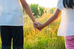Elder sister and younger sister holds the hand royalty free stock photography Elder sister and younger sister holds the hand royalty free stock photography