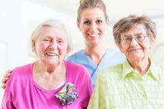 Elderly care nurse with two senior women stock photography Elderly care nurse with two senior women stock photography
