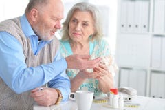 Elderly couple with pills Royalty Free Stock Photo Elderly couple with pills Royalty Free Stock Photo
