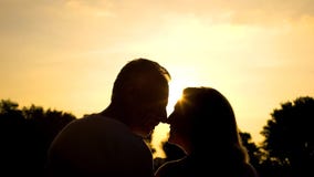 Elderly husband and wife nuzzling, happy marriage, retired couple happiness stock image Elderly husband and wife nuzzling, happy marriage, retired couple happiness stock image