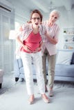 Elderly lady supporting her pregnant daughter feeling some pain stock images Elderly lady supporting her pregnant daughter feeling some pain stock images