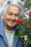 Elderly woman and flowers