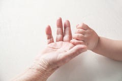 Elderly woman and a kid hands together royalty free stock photos Elderly woman and a kid hands together royalty free stock photos