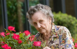 Elderly Woman Smelling Flowers Stock Images Elderly Woman Smelling Flowers Stock Images