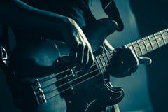 Electric bass guitar player hands, live music stock images Electric bass guitar player hands, live music stock images
