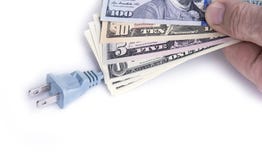 Electric plug with dollar money on the white. Energy save concept. stock photos Electric plug with dollar money on the white. Energy save concept. stock photos