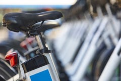 Electrical bikes on a parking. Charging batteries. Renewable ene royalty free stock photography Electrical bikes on a parking. Charging batteries. Renewable ene royalty free stock photography