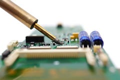 Electrical Engineer is soldering on printed circuit board Royalty Free Stock Photo Electrical Engineer is soldering on printed circuit board Royalty Free Stock Photo