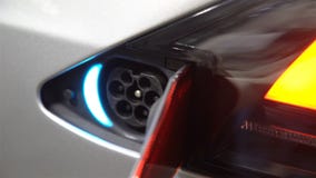 Electrical outlet on the housing of the electric car. stock video Electrical outlet on the housing of the electric car. stock video