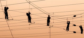 Electricians repair contact wire at sunset. Electricians repair contact wire on electrified railway at sunset Electricians repair contact wire at sunset. Electricians repair contact wire on electrified railway at sunset