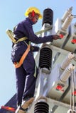 Electricians working on high voltage power lines stock image Electricians working on high voltage power lines stock image