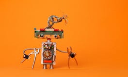 Electricista divertido del robot con los alicates Juguete robótico del diseño creativo con el peinado eléctrico de los alambres, fotografía de archivo Electricista divertido del robot con los alicates Juguete robótico del diseño creativo con el peinado eléctrico de los alambres, fotografía de archivo