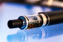 Electronic cigarette with liquid, harm of smoking, social problem of smoking stock photo Electronic cigarette with liquid, harm of smoking, social problem of smoking stock photo