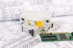 Electronics and Engineering. Printed drawings of electrical circuits, electronic board and modular circuit breaker. Science, techn royalty free stock images Electronics and Engineering. Printed drawings of electrical circuits, electronic board and modular circuit breaker. Science, techn royalty free stock images