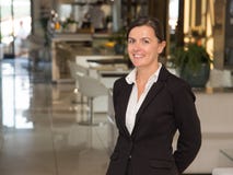 Elegant and cheerful woman receptionist Royalty Free Stock Image Elegant and cheerful woman receptionist Royalty Free Stock Image