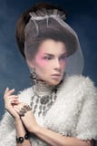 Elegant lady in a fur coat with a veil stock photo Elegant lady in a fur coat with a veil stock photo