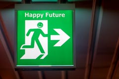 The emergency exit sign with wish happy future. Royalty Free Stock Images The emergency exit sign with wish happy future. Royalty Free Stock Images