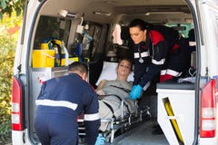 Emergency medical staff transporting patient stock photos Emergency medical staff transporting patient stock photos