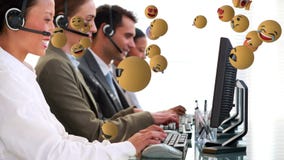 Emoji icons with a group of people working in call centre in the background