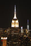 The Empire State Building in the skyline of New York at night stock photos The Empire State Building in the skyline of New York at night stock photos