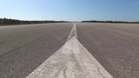 Empty airport runway low angle stock video footage Empty airport runway low angle stock video footage