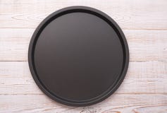 Empty Baking Tray For Pizza Close Up On Wooden Background Top View Horizontally. Mock Up For Design Royalty Free Stock Photography Empty Baking Tray For Pizza Close Up On Wooden Background Top View Horizontally. Mock Up For Design Royalty Free Stock Photography