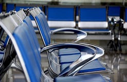 Empty blue chairs at the waiting area in the terminal stock photography Empty blue chairs at the waiting area in the terminal stock photography