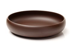Empty brown ceramic plate. Over white background Royalty Free Stock Photo Empty brown ceramic plate. Over white background Royalty Free Stock Photo