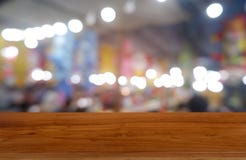Empty dark wooden table in front of abstract blurred background of cafe and coffee shop interior. can be used for display or stock photo Empty dark wooden table in front of abstract blurred background of cafe and coffee shop interior. can be used for display or stock photo