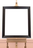 Blank empty frame on painting easel, background stock images Blank empty frame on painting easel, background stock images