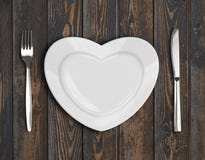 Empty heart plate top view on wood table royalty free stock image Empty heart plate top view on wood table royalty free stock image