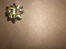 Empty message area with ornament as yellow bright star, note paper on dark and light brown background. stock photos Empty message area with ornament as yellow bright star, note paper on dark and light brown background. stock photos