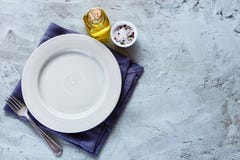 Empty plate and fork stock images Empty plate and fork stock images