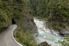Empty Road At A Rugged, Rocky And Lush Landscape At Taroko Stock Photos Empty Road At A Rugged, Rocky And Lush Landscape At Taroko Stock Photos