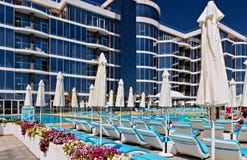 Empty Sunbeds and umbrellas tropical beach resorts stock image Empty Sunbeds and umbrellas tropical beach resorts stock image