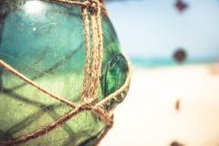 Empty vintage glass jar with rope on tropical beach with blurred background and copy space Royalty Free Stock Photos Empty vintage glass jar with rope on tropical beach with blurred background and copy space Royalty Free Stock Photos