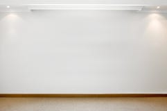 Empty white wall with carpeted floor