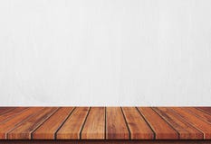 Empty wood table top on white concrete background royalty free stock photography Empty wood table top on white concrete background royalty free stock photography