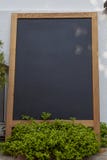 Empty wooden framed chalkboard display for restaurant menus at Tenedos Bozcaada Island by Aegean Sea royalty free stock images Empty wooden framed chalkboard display for restaurant menus at Tenedos Bozcaada Island by Aegean Sea royalty free stock images