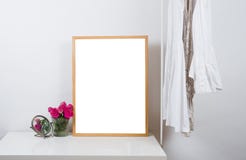 Empty wooden picture frame on the table, art print mock-up stock image Empty wooden picture frame on the table, art print mock-up stock image