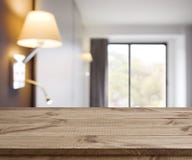 Empty wooden table on defocused simple hotel room interior background royalty free stock photos Empty wooden table on defocused simple hotel room interior background royalty free stock photos