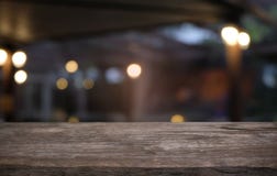 Empty wooden table in front of abstract blurred background of co stock images Empty wooden table in front of abstract blurred background of co stock images