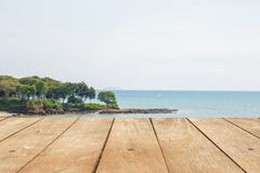 Empty wooden table or plank with island beach nature view on background. royalty free stock photo Empty wooden table or plank with island beach nature view on background. royalty free stock photo