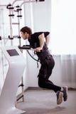 EMS male working out, doing push ups. man doing triceps dips on parallel bars royalty free stock image EMS male working out, doing push ups. man doing triceps dips on parallel bars royalty free stock image