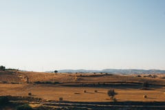 End of day over field with hay bale stock photography End of day over field with hay bale stock photography