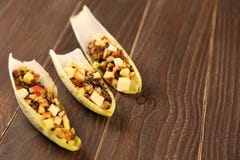 Endive or chicory salad with beetroot, goat cheese and nuts Stock Image Endive or chicory salad with beetroot, goat cheese and nuts Stock Image